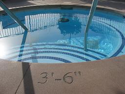 Balboa Bay Club Pool Depth Markers on Concrete