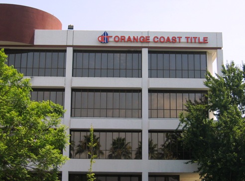 Orange Coast Title Building Sign Freeway View in Anaheim CA