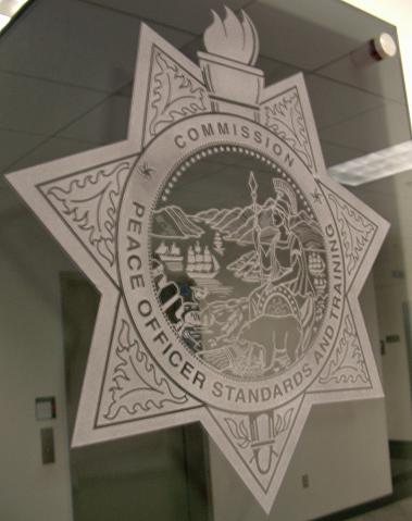 Peace Officers Standards Training Commission Glass Sign